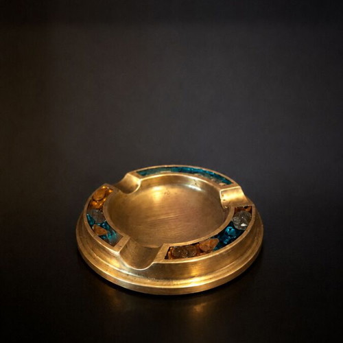 Vintage metal ashtray with mosaic design used