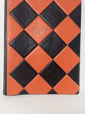 Vintage photo album used, orange and black checkered