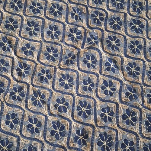 Blue embroidered decorative square used with gold thread
