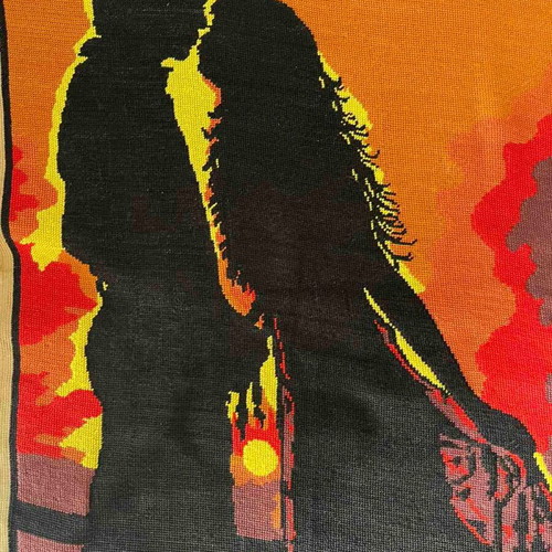 Handmade embroidered textile painting like new, silhouette of a couple at sunset