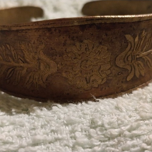 Vintage copper cuff bracelet with Greek neoclassical motifs, used