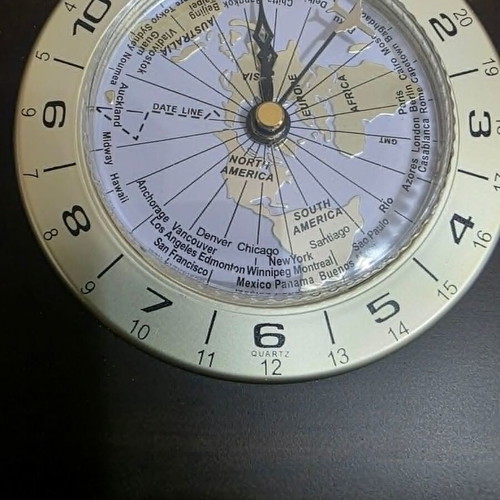 Luxury analog desk clock with world map and airplane needle