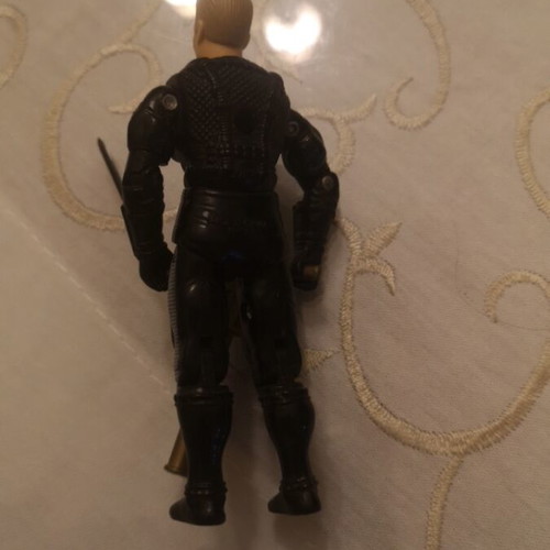 G.I. Joe action figure with weapons
