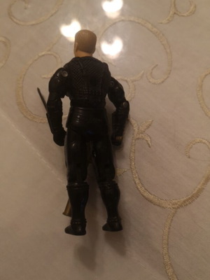 G.I. Joe action figure with weapons