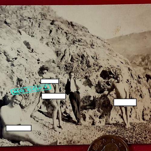 Vintage 1930s black and white nudist photo on rocky coast