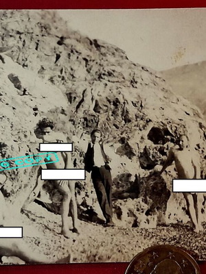 Vintage 1930s black and white nudist photo on rocky coast