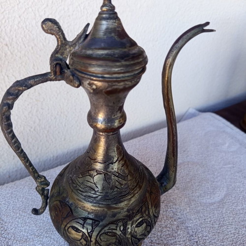 Brass jug with engraved decoration, Asian origin