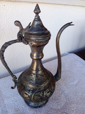 Brass jug with engraved decoration, Asian origin