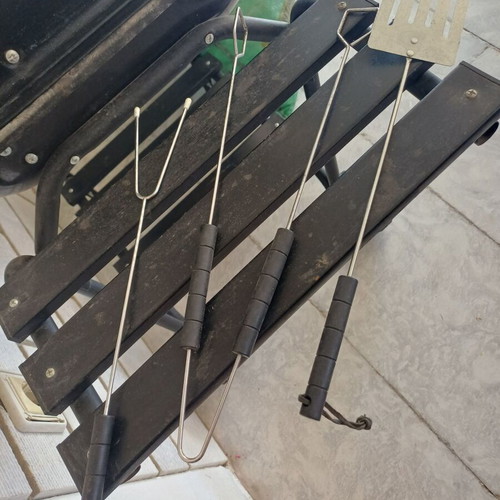 Charcoal grill used, wheeled with shelves and tools