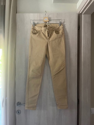 Zara pants size small used, beige, fitted with elastic fabric