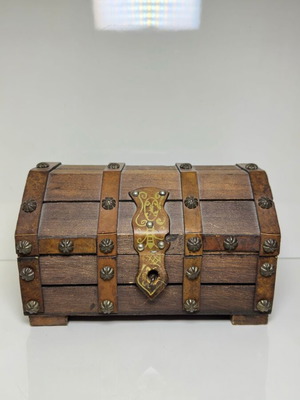 Vintage wooden jewelry box used with leather and metal details