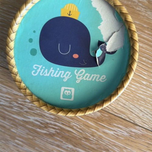 Fishing game used with wooden magnetic rods and numbered fish