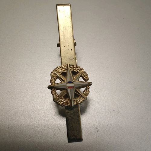 Collectible tie clip used, gold color with French security emblem