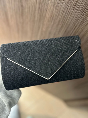 Black clutch handbag like new with embossed texture