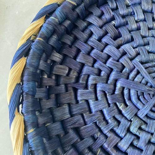 Blue handmade wicker basket with painted porcelain handles like new