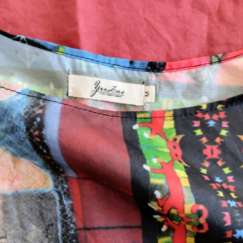 Slanted women's tunic blouse used, size medium, with belt