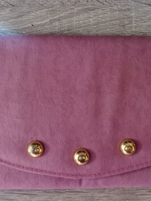 Clutch bag used with velvet texture and gold details