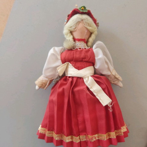 Vintage doll used with porcelain head and embroidered apron