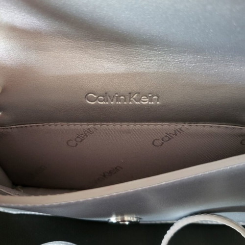 Calvin Klein silver bag like new with logo