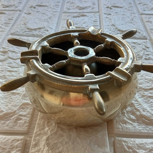 Brass ashtray used with nautical style and water feature