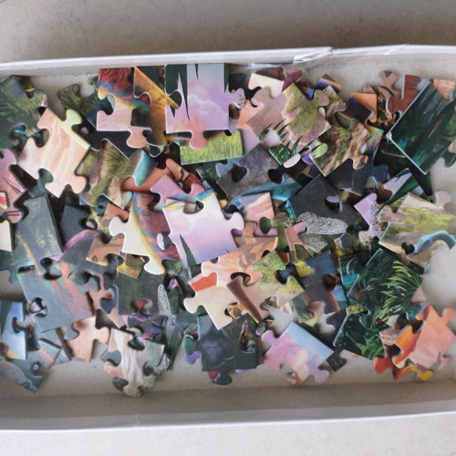 Dinosaur puzzles like new, 75 and 100 pieces