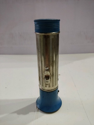Metal flashlight used from the 1970s missing bulb and spring
