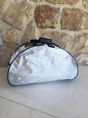 Smiley metallic travel bag used with embossed smiley and star designs