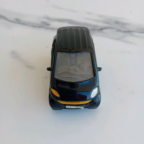 Smart toy car used, metal and plastic, with spark needs repair