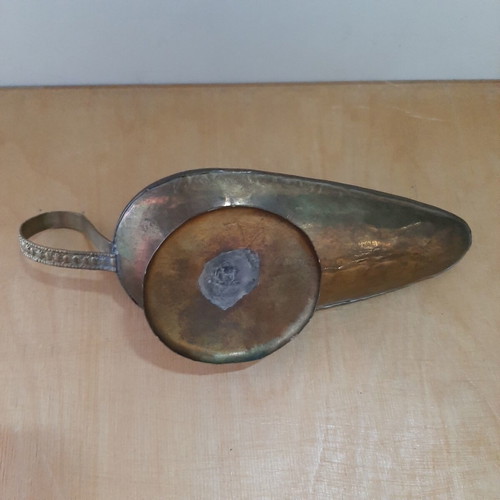Copper oil lamp used with carved decorations and patina