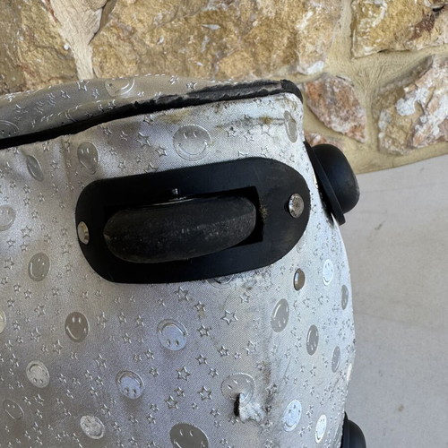 Smiley metallic travel bag used with embossed smiley and star designs