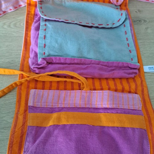 Cloth bag with doll and clothes used