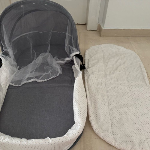 Portable travel baby cot with mosquito net new, converts to bag