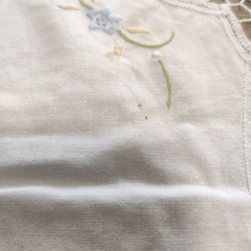 Small tablecloth used, white with lace and flowers