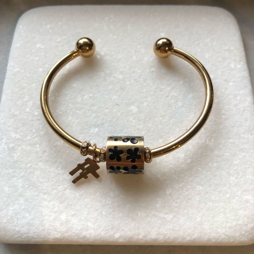 Folli Follie gold bracelet bangle with black enamel charm like new