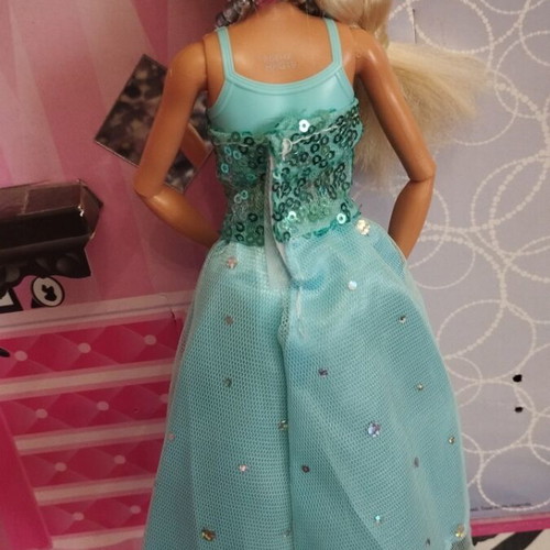 Vintage Barbie doll with handmade shoes and accessories