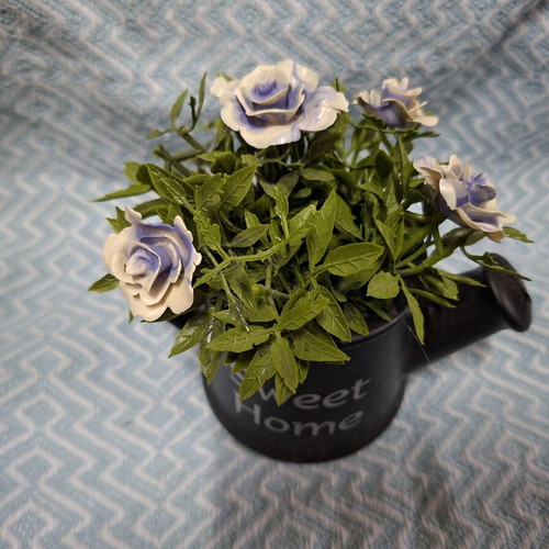 Small decorative watering can with flowers, like new