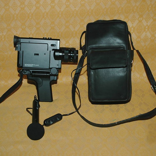 Cine film camera used with microphone and leather case