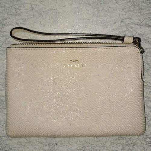 Coach wristlet bag used, beige with strap