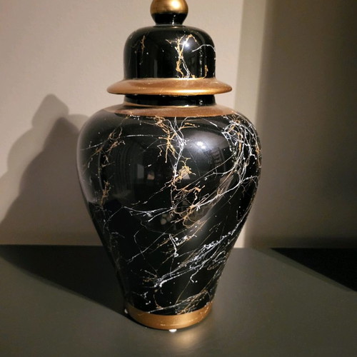 Decorative vase used with lid, black marble look and gold details