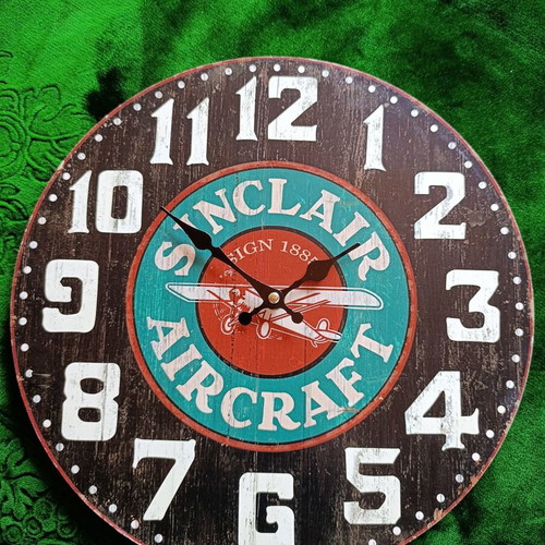 Sinclair Aircraft retro wall clock with airplane design