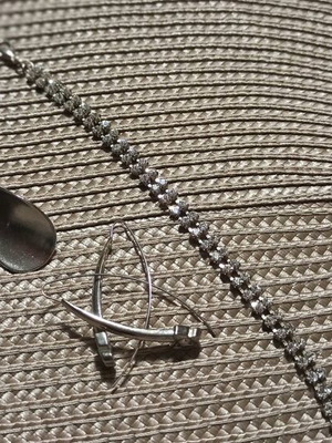 Earrings and bracelet in silver tone like new, 2 pairs of earrings