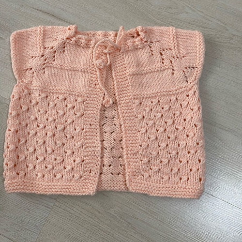 Knitted baby vest like new in peach color