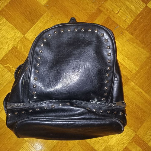Backpack black leather type used with multiple pockets