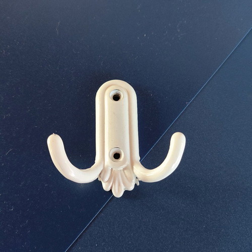 Small white metal hook like new