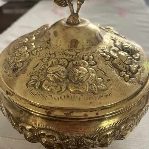 Vintage brass jewelry box used with embossed floral motifs