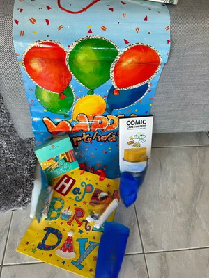 Party supplies with two gift bags and Happy Jackson candles like new
