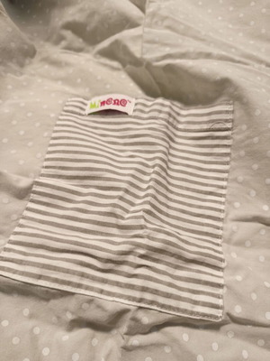 Nursing cover with storage pouch used