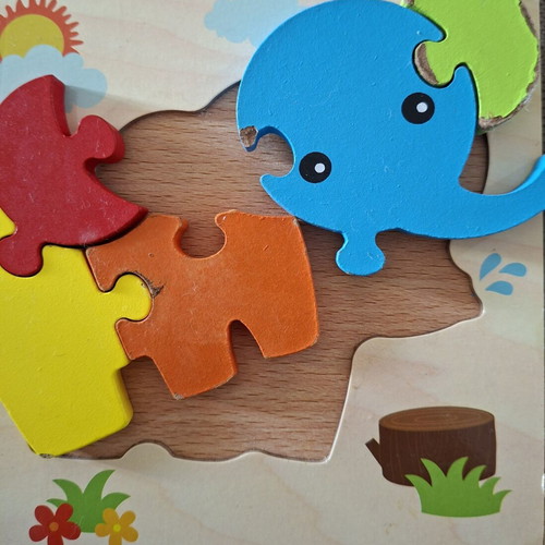 Wooden puzzles for children used, owl and elephant