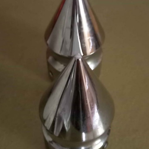 Spike-shaped caps for front wheel axle