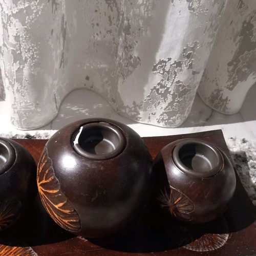 Plate with three wooden candlesticks used